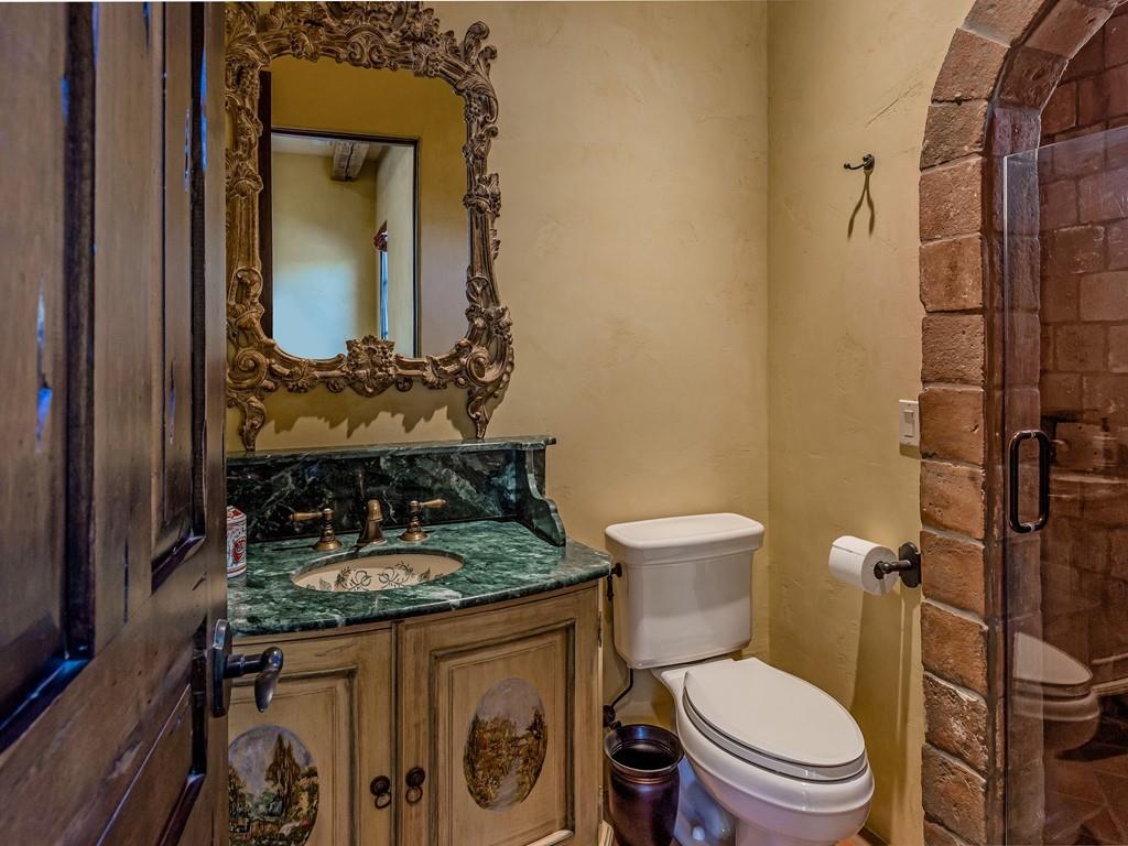 2900 Soma Way Gilroy, CA 95020 - Photo 31 of 61 a bathroom with a granite countertop toilet sink and mirror