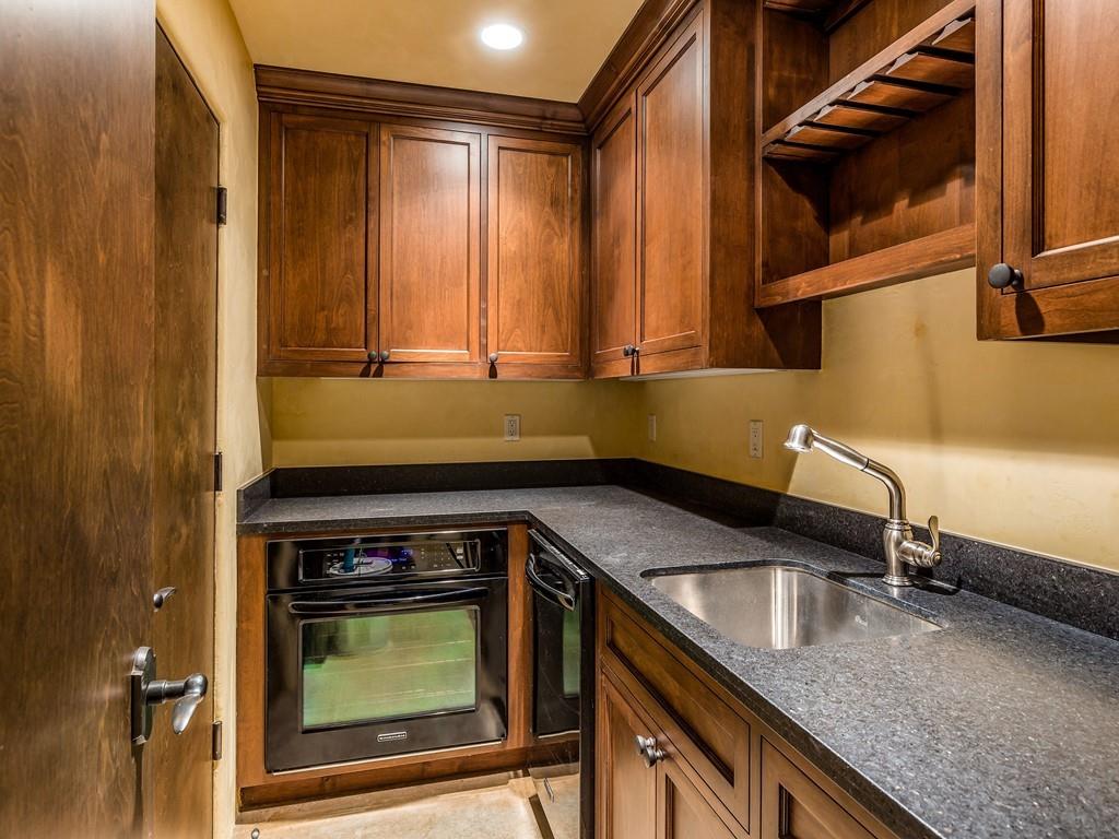 2900 Soma Way Gilroy, CA 95020 - Photo 43 of 61 a kitchen with granite countertop a sink a stove and cabinets