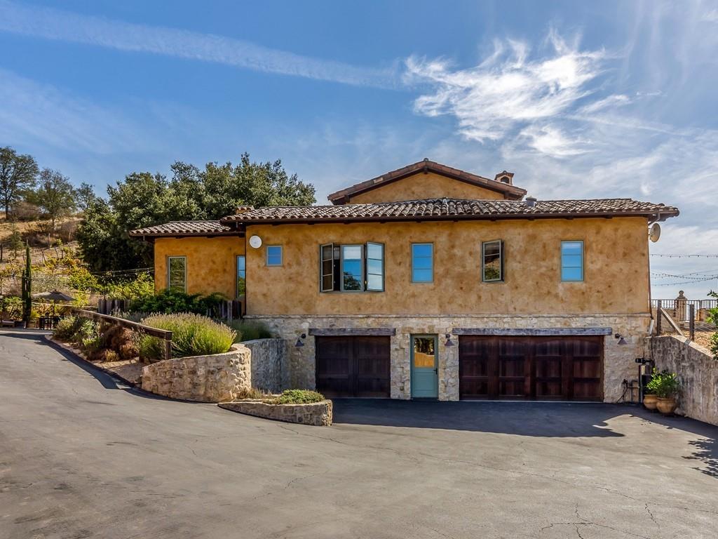 2900 Soma Way Gilroy, CA 95020 - Photo 47 of 61 a front view of a house with a garden and garage