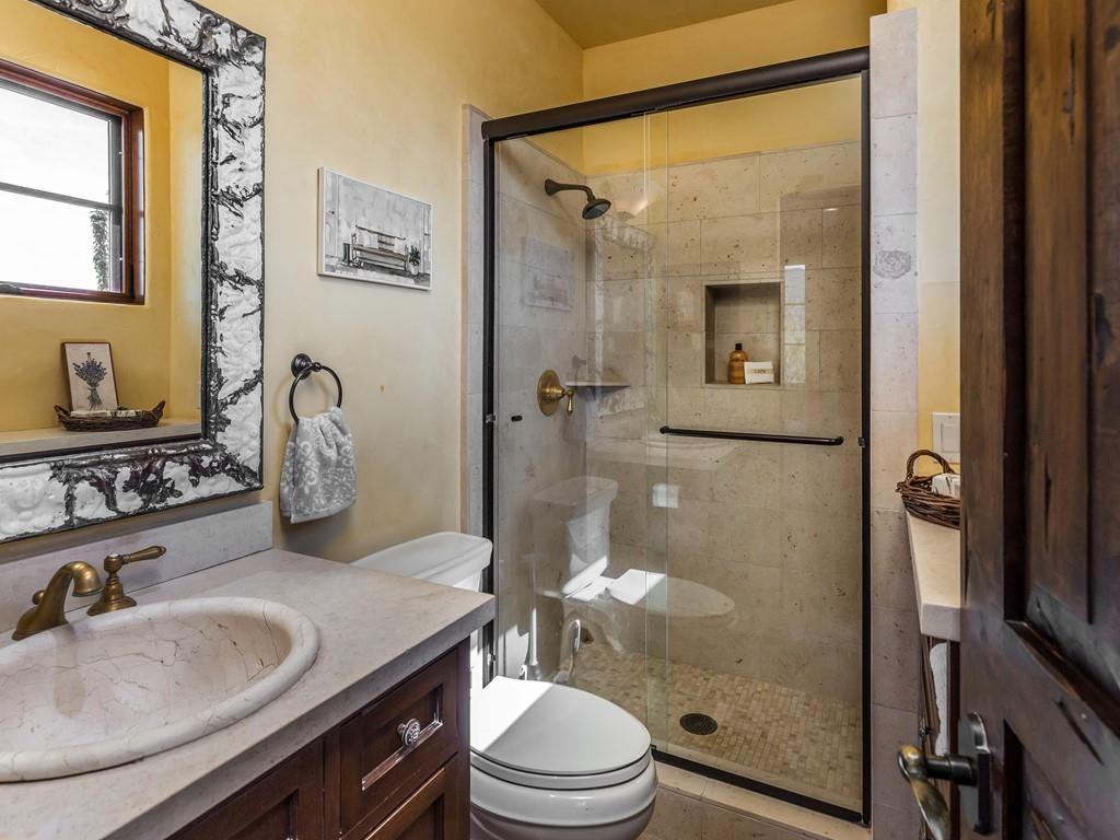 2900 Soma Way Gilroy, CA 95020 - Photo 56 of 61 a bathroom with a granite countertop sink toilet a mirror and shower