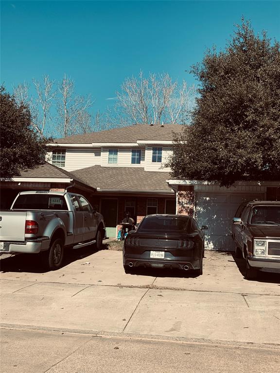 a view of a car parked in front of a house