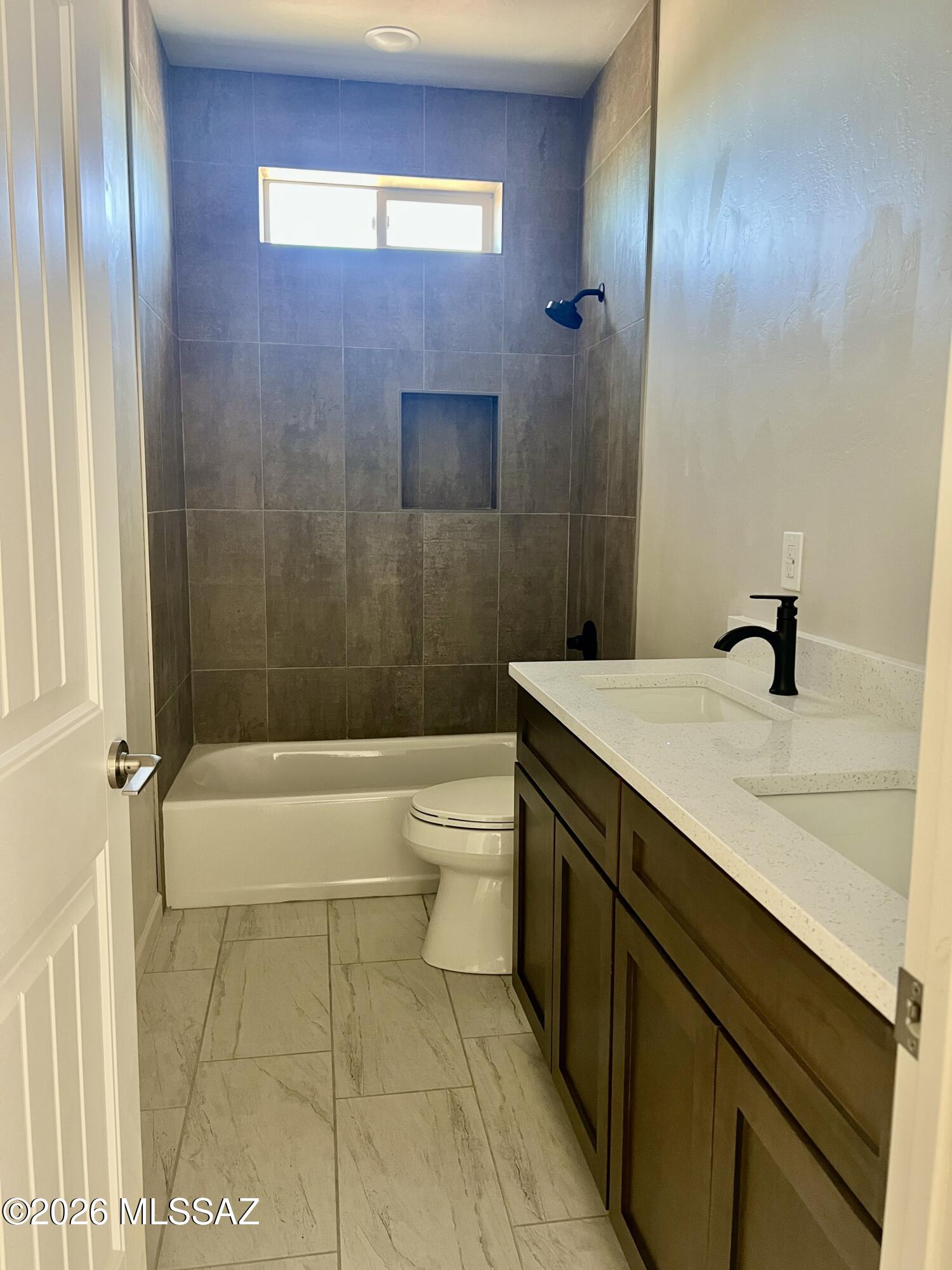 1501 Circulo Sombrero Rio Rico, AZ 85648 - Photo 12 of 26 a bathroom with a sink a toilet and shower
