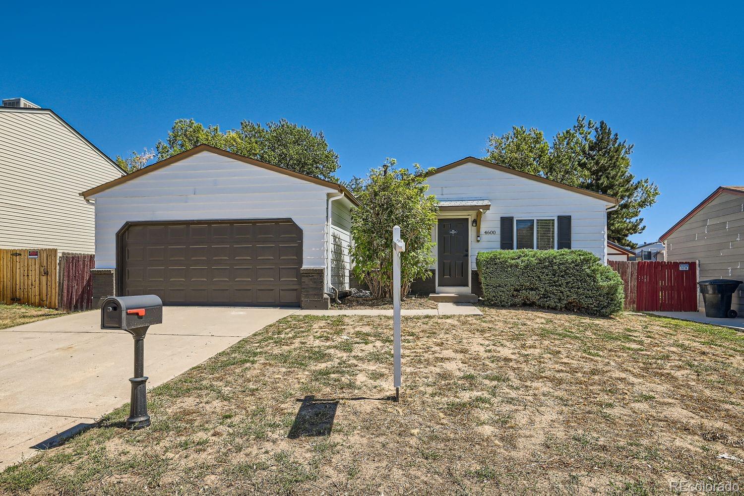 a front view of a house with yard