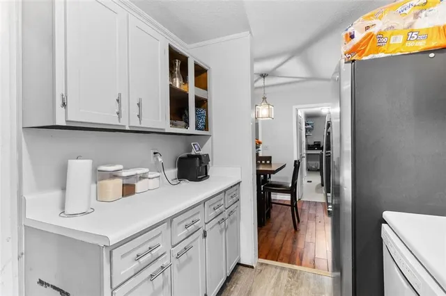 a kitchen with cabinets and window