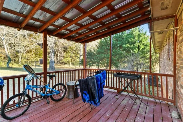a view of porch with furniture and wooden floor