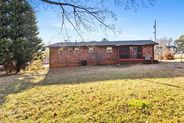 a view of a house with a snow on the road