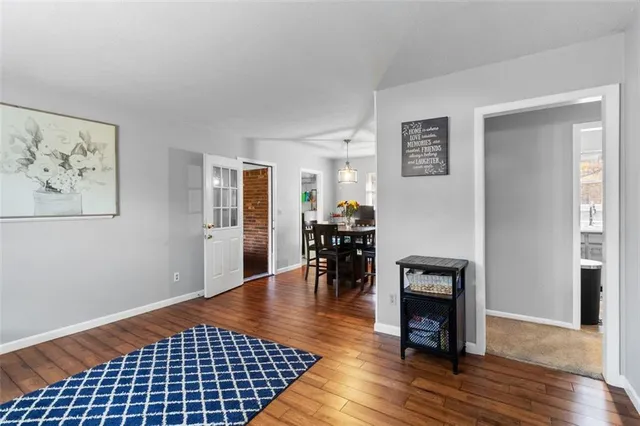 a view of a livingroom with furniture and a workspace