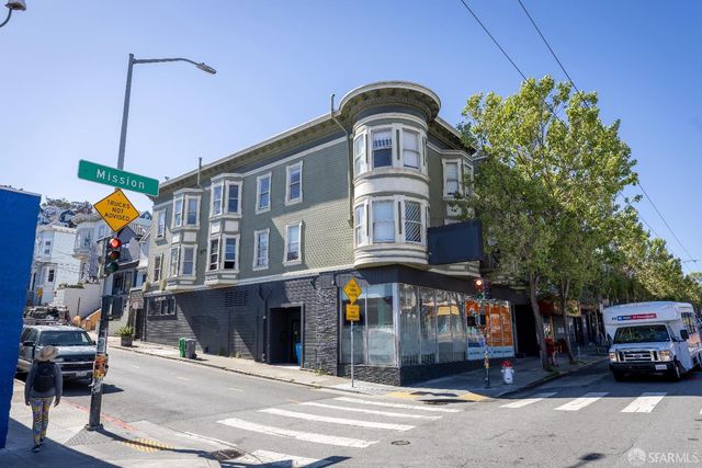a front view of a building with parking