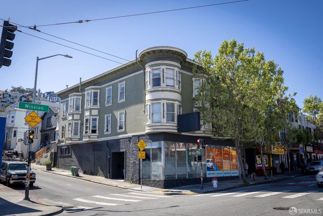 a front view of building with street