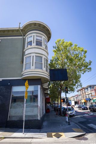 a view of a room with furniture and wooden floor