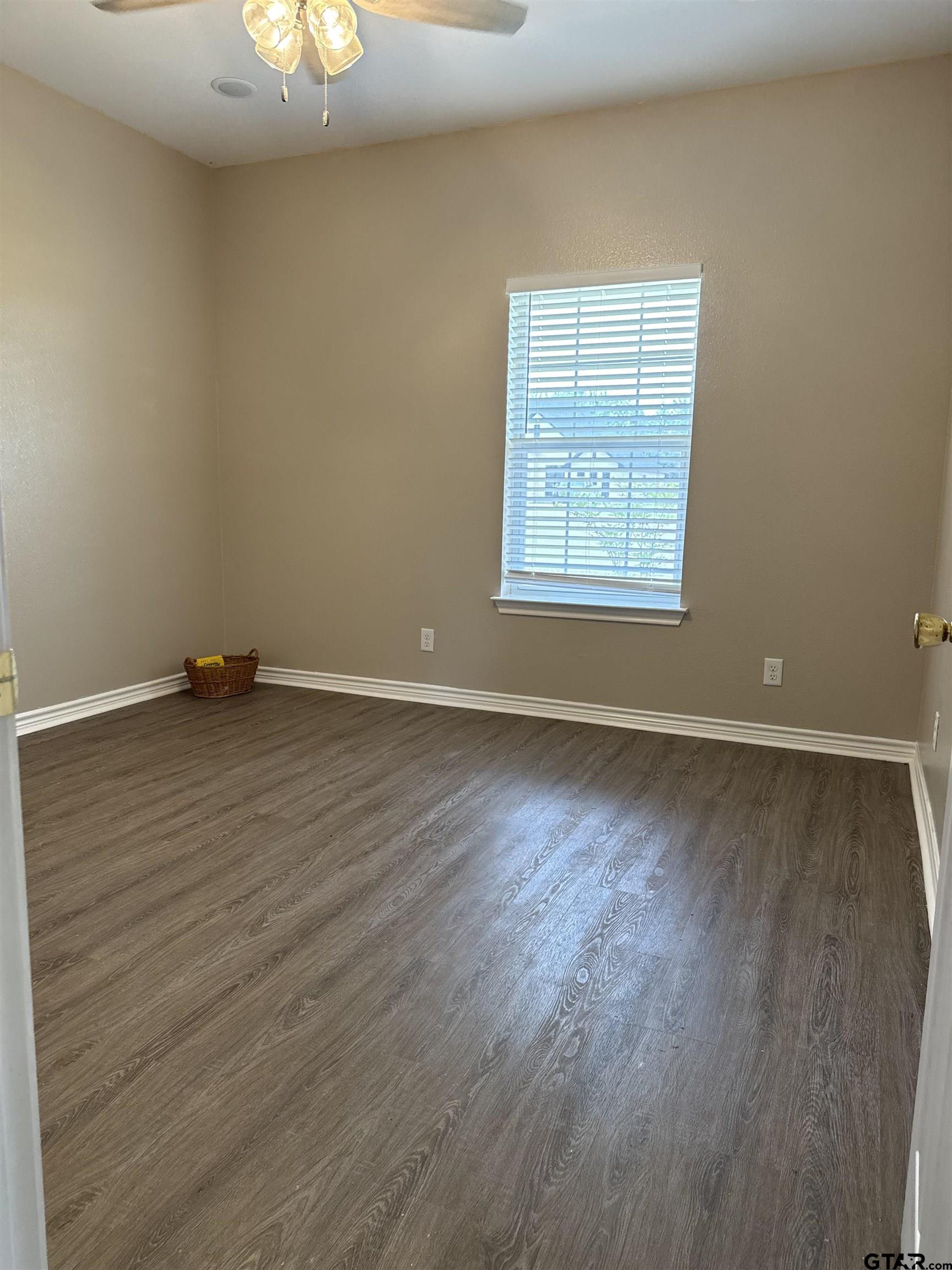 14965 Turtle Crk Rnch Road Flint, TX 75762 - Photo 26 of 26 an empty room with wooden floor and windows