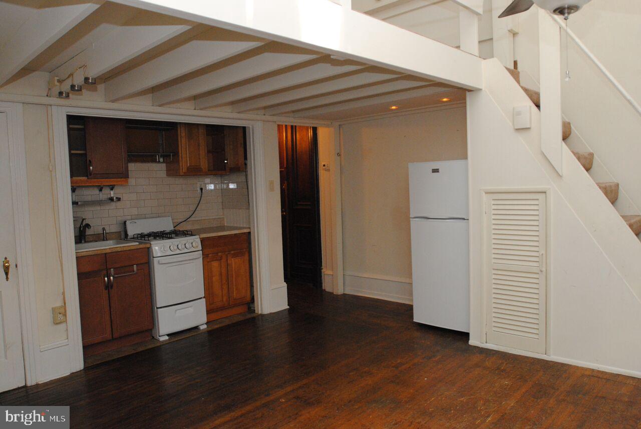 2008 Spruce Street, Unit 1F Philadelphia, PA 19103 - Photo 12 of 15 a kitchen with stainless steel appliances granite countertop a refrigerator and a sink