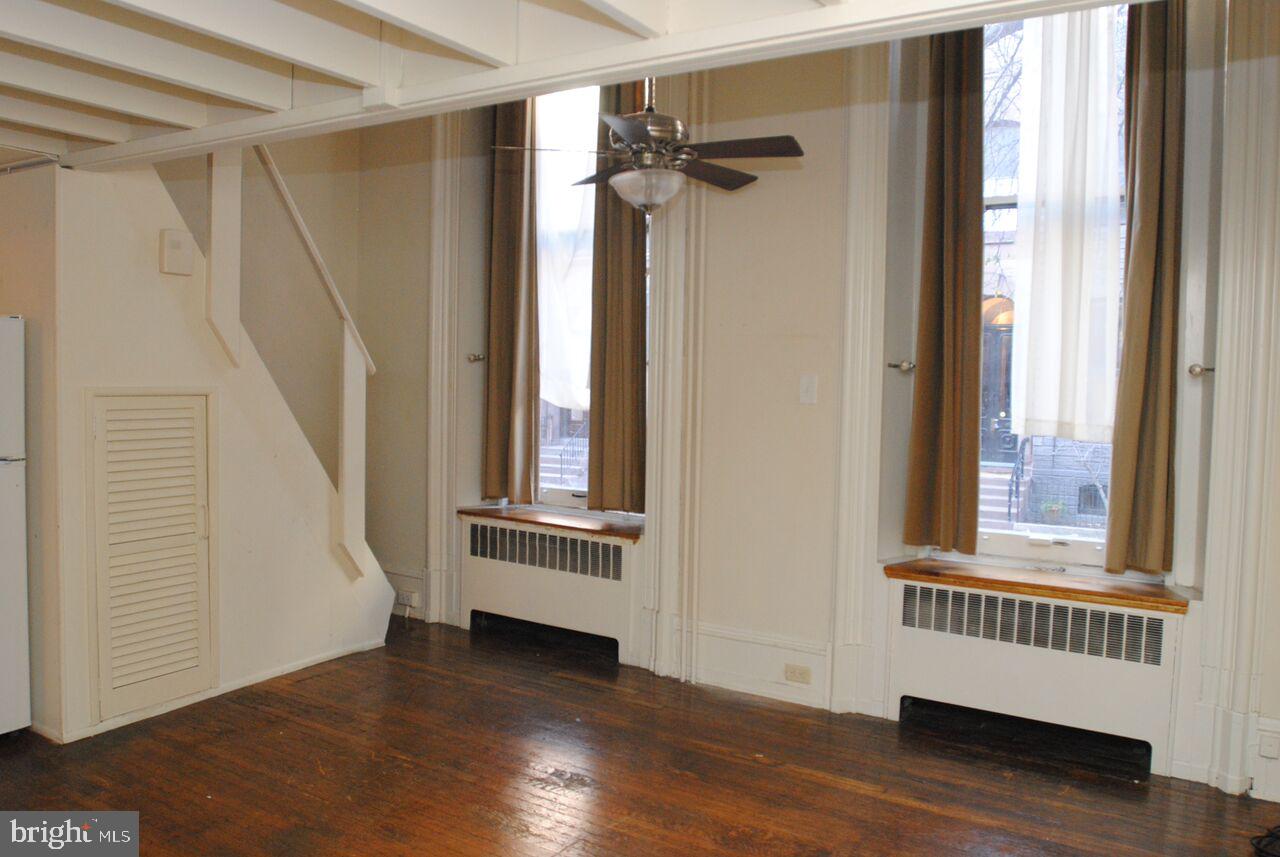 2008 Spruce Street, Unit 1F Philadelphia, PA 19103 - Photo 2 of 15 a view of front door with wooden floor and stairs