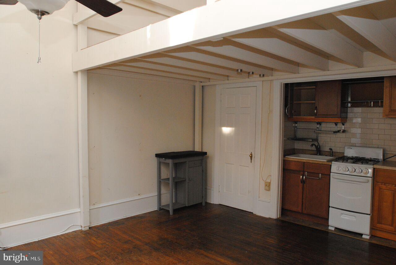 2008 Spruce Street, Unit 1F Philadelphia, PA 19103 - Photo 5 of 15 a kitchen with a sink and cabinets