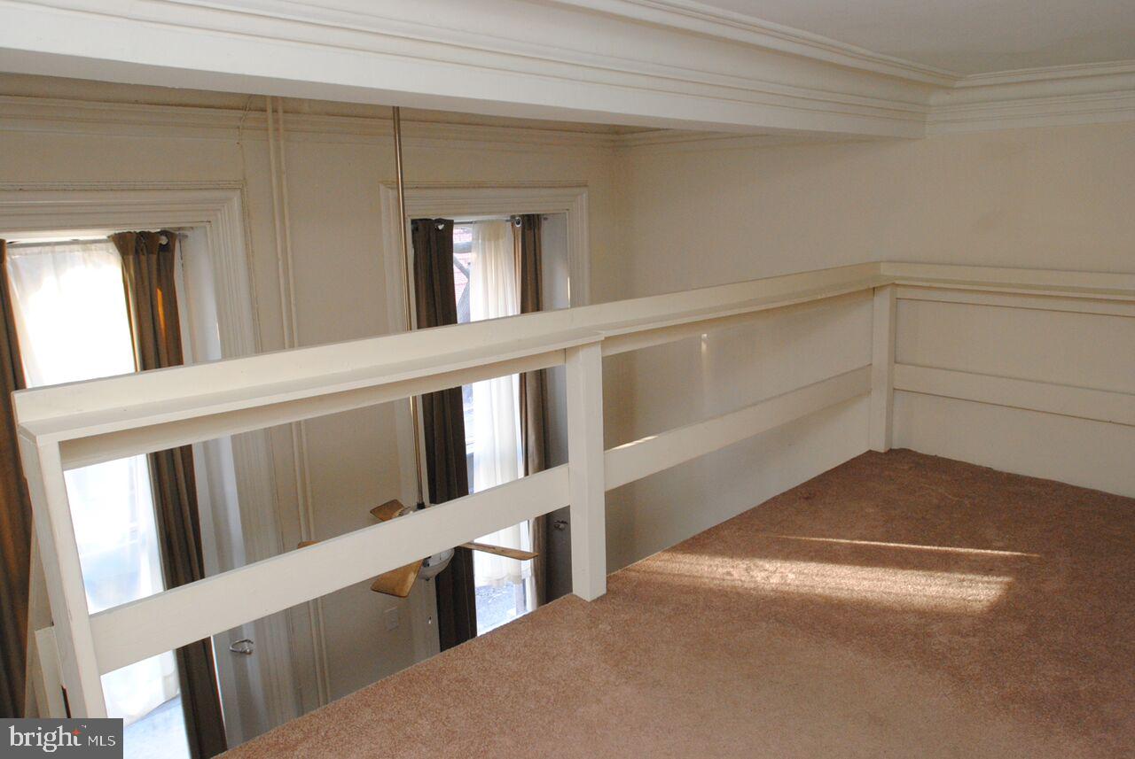 2008 Spruce Street, Unit 1F Philadelphia, PA 19103 - Photo 7 of 15 a view of an empty room and window