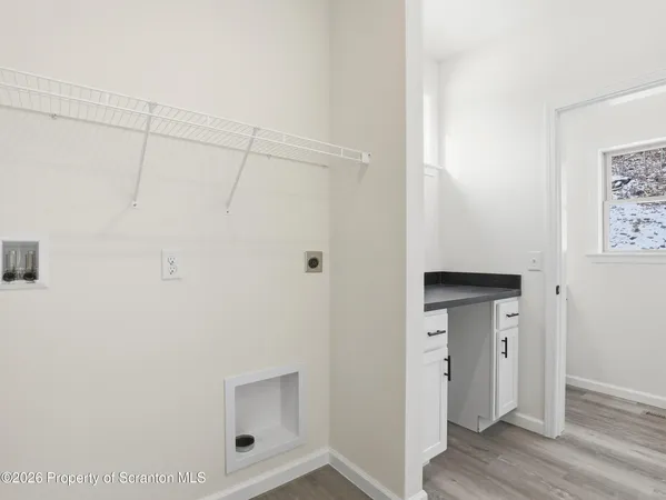 a view of bathroom with wooden floor
