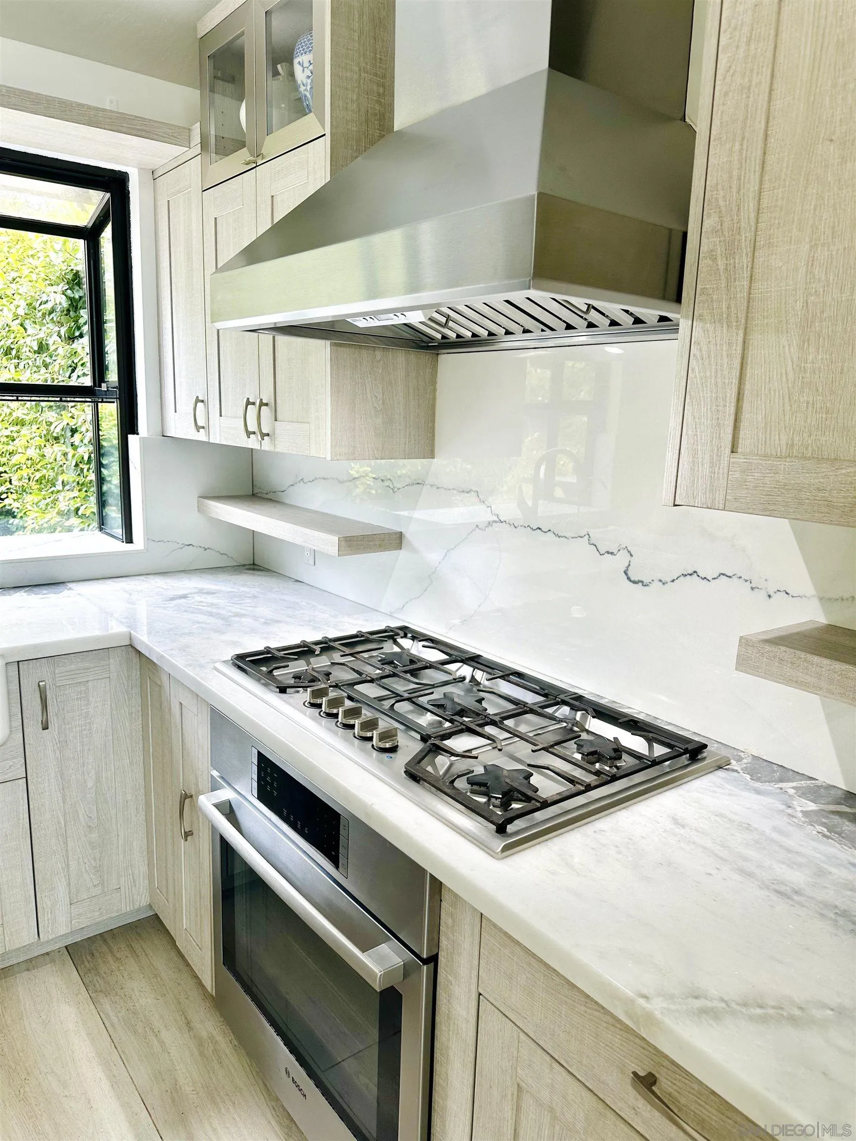 2310 Via Munera La Jolla, CA 92037 - Photo 8 of 50 a white stove top oven sitting inside of a kitchen