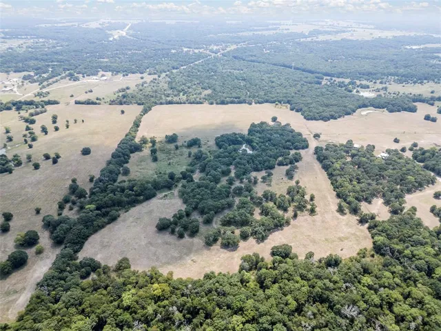 an aerial view of mountain with beach
