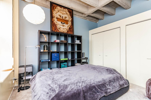 811 South Lytle Street, Unit 403 Chicago, IL 60607 - Photo 14 of 19 a bedroom with a bed and closet