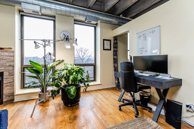 811 South Lytle Street, Unit 403 Chicago, IL 60607 - Photo 8 of 19 a view of a workspace with furniture window and wooden floor