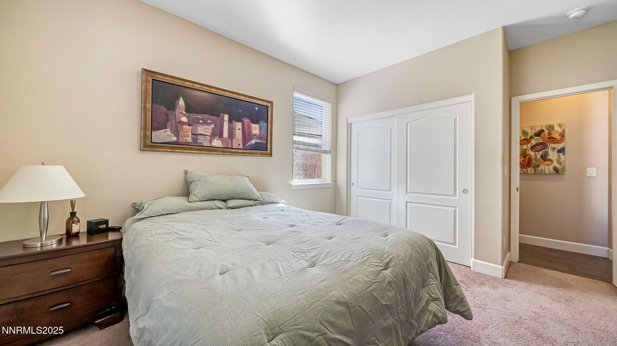 10115 Barrel Racer Drive Reno, NV 89521 - Photo 20 of 74 a bedroom with a bed and a lamp on dresser