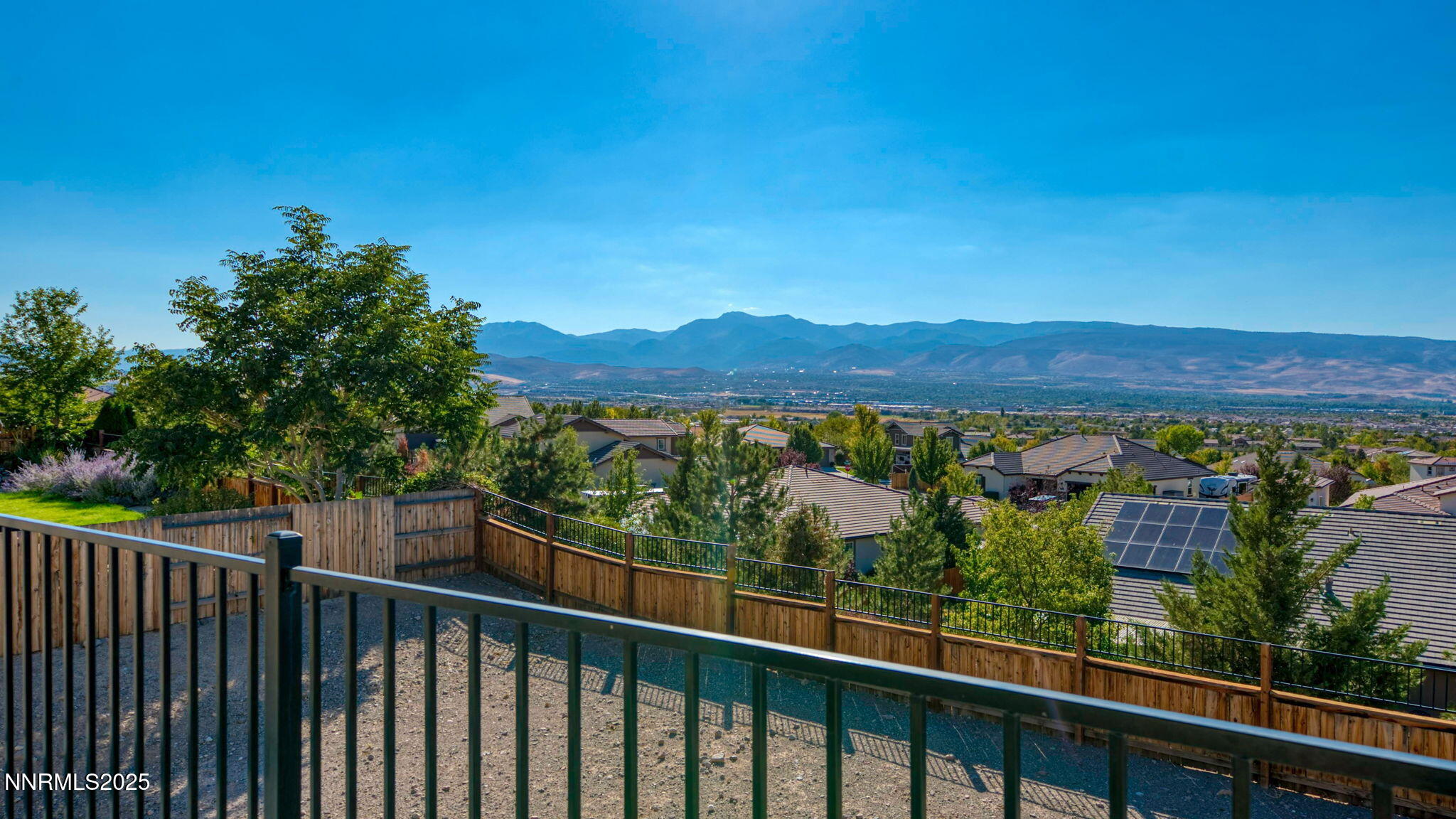 10115 Barrel Racer Drive Reno, NV 89521 - Photo 28 of 74 a view of a green field with a mountain in the background