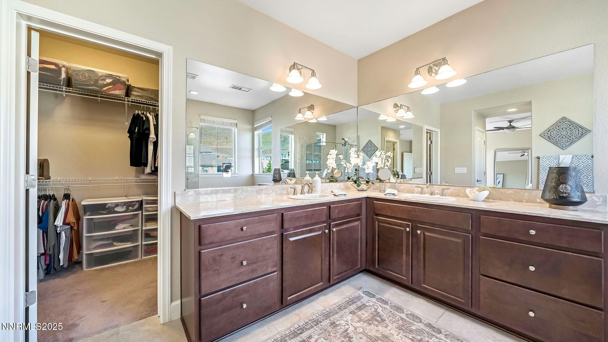 10115 Barrel Racer Drive Reno, NV 89521 - Photo 32 of 74 a spacious bathroom with a granite countertop sink a mirror and a