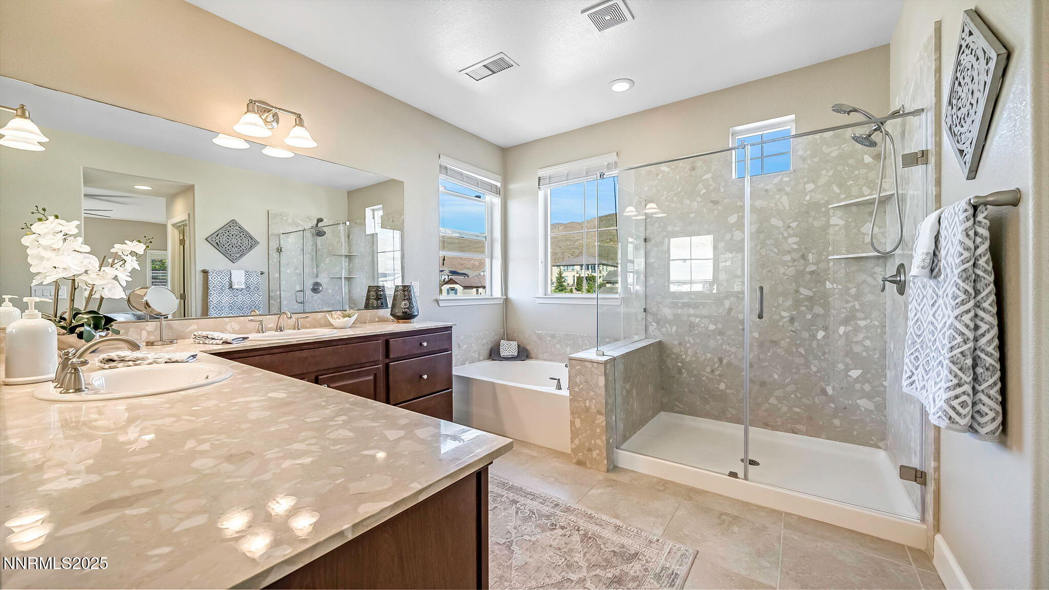 10115 Barrel Racer Drive Reno, NV 89521 - Photo 33 of 74 a spacious bathroom with a bathtub shower sink and mirror