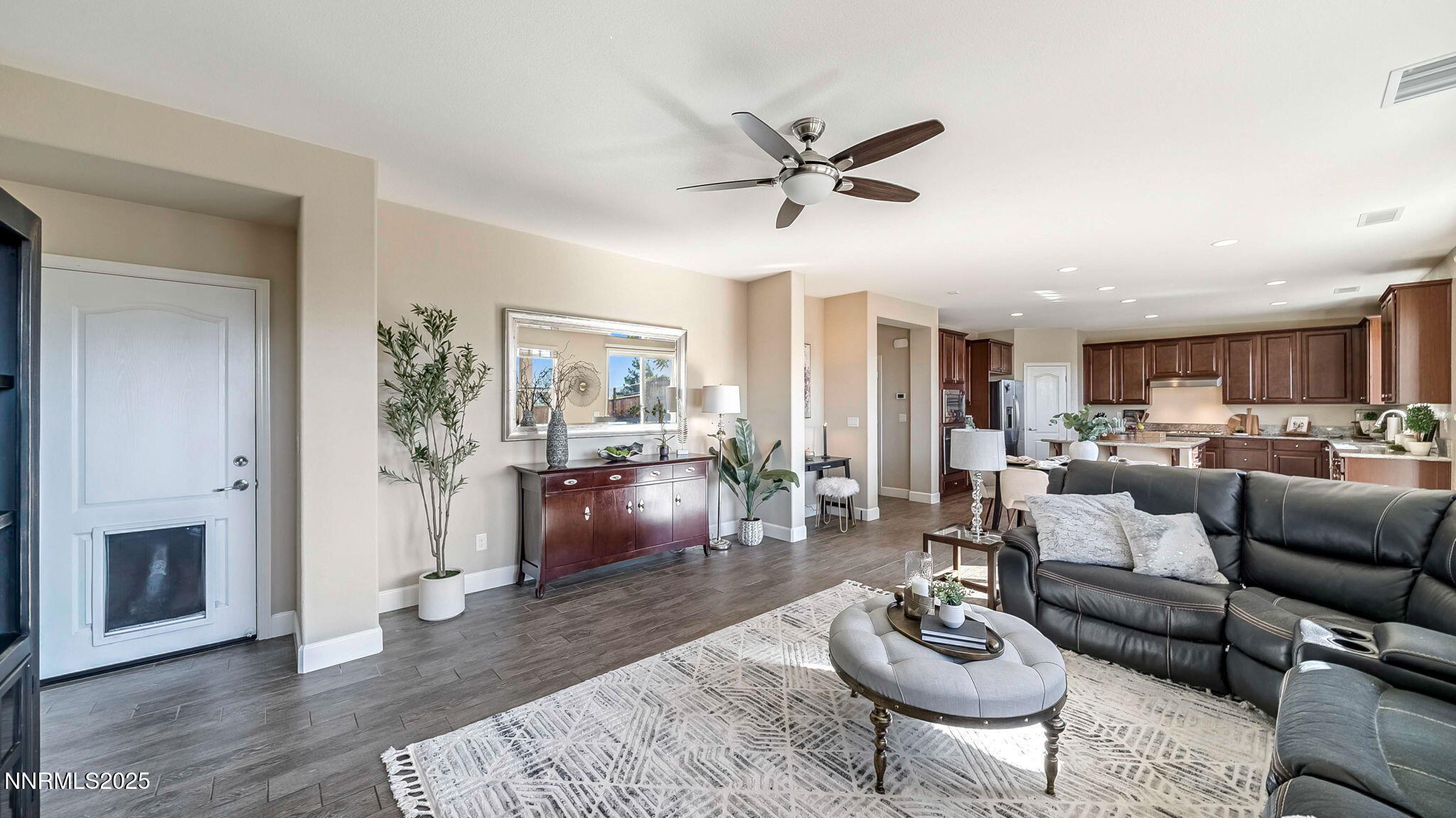 10115 Barrel Racer Drive Reno, NV 89521 - Photo 45 of 74 a living room with furniture a fireplace a rug and a window