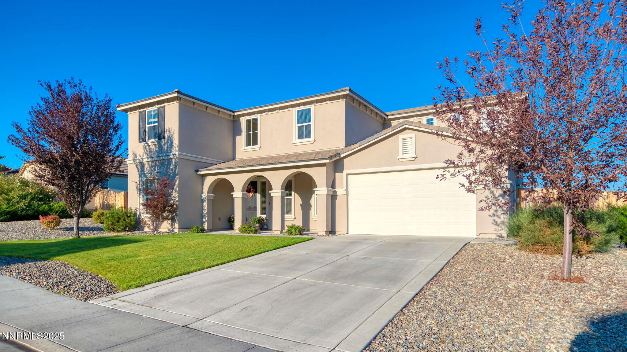 10115 Barrel Racer Drive Reno, NV 89521 - Photo 49 of 74 a front view of a house with a yard