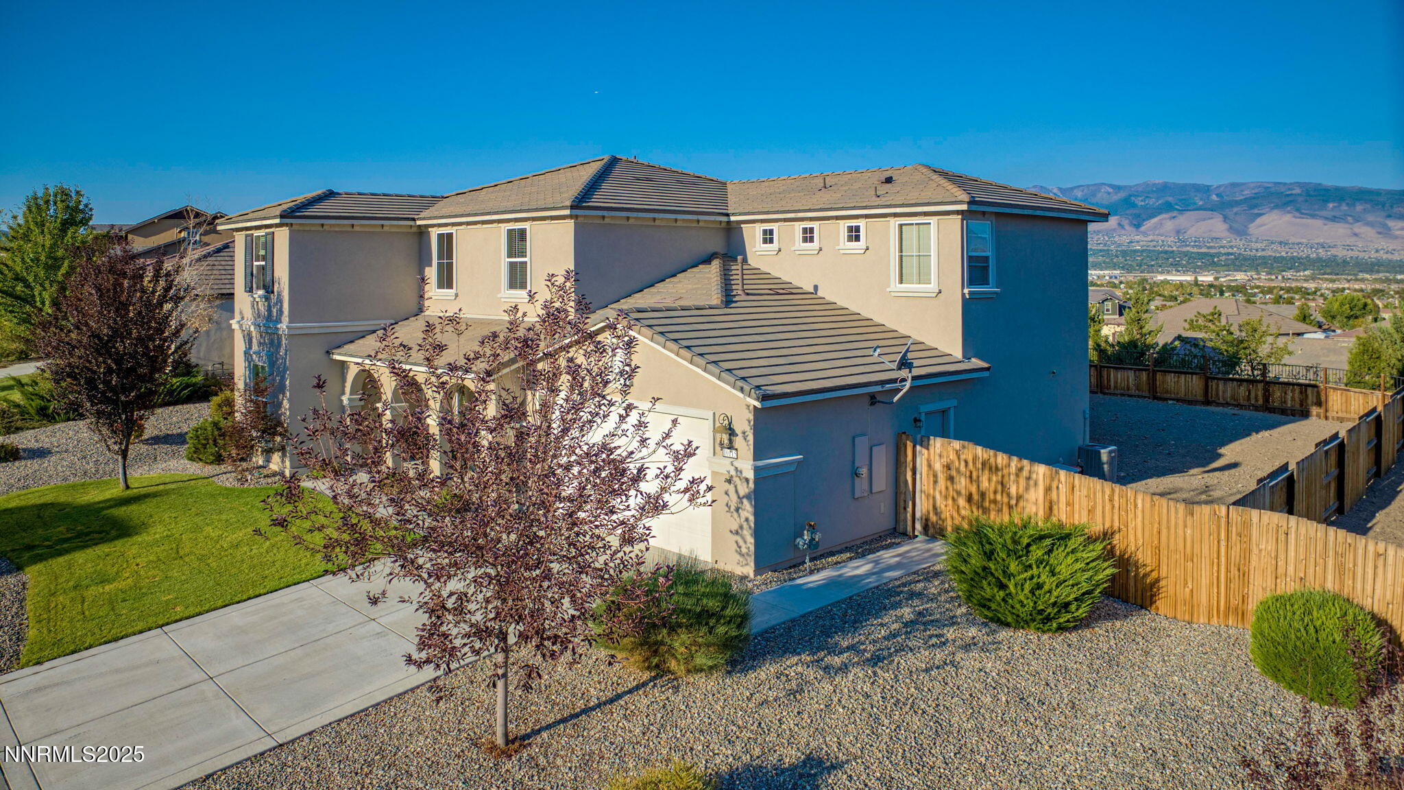 10115 Barrel Racer Drive Reno, NV 89521 - Photo 52 of 74 a front view of a house with garden