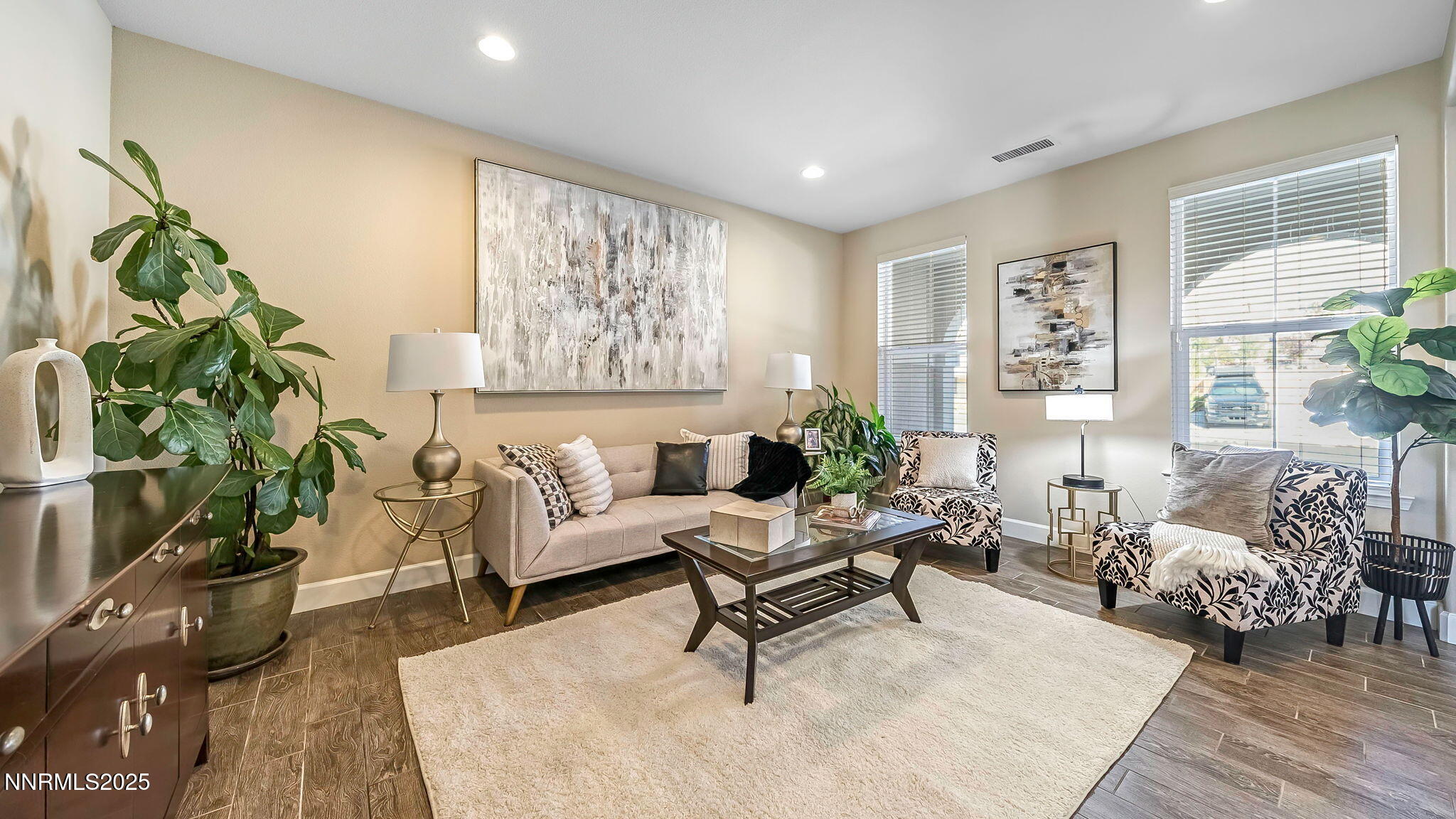 10115 Barrel Racer Drive Reno, NV 89521 - Photo 6 of 74 a living room with furniture and a potted plant