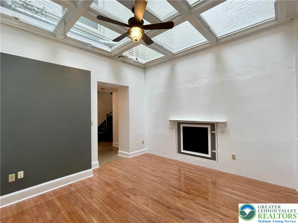 147 South 4th Street, Unit 3 Easton, PA 18042 - Photo 11 of 21 a view of an empty room with wooden floor and a window