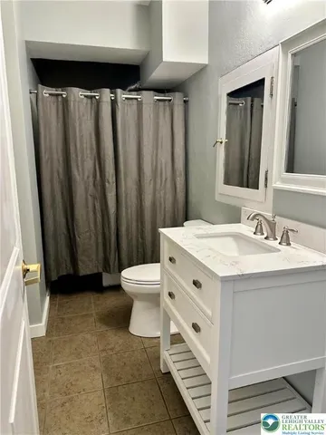 a en suite bathroom with a sink and a bathtub