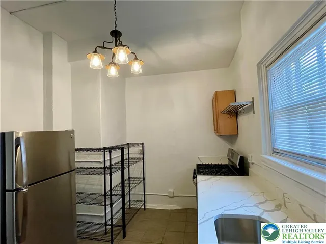 a sink a stove and cabinets