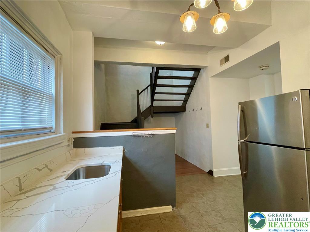 147 South 4th Street, Unit 3 Easton, PA 18042 - Photo 6 of 21 a kitchen with stainless steel appliances granite countertop a refrigerator and a sink