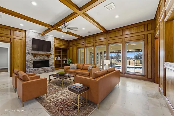 a living room with fireplace furniture and a flat screen tv