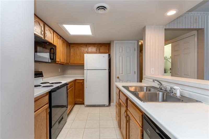 1269 Riverside Drive, Unit C Beaver, PA 15009 - Photo 4 of 20 Galley kitchen, all appliances stay microwave and garbage disposal are new.
