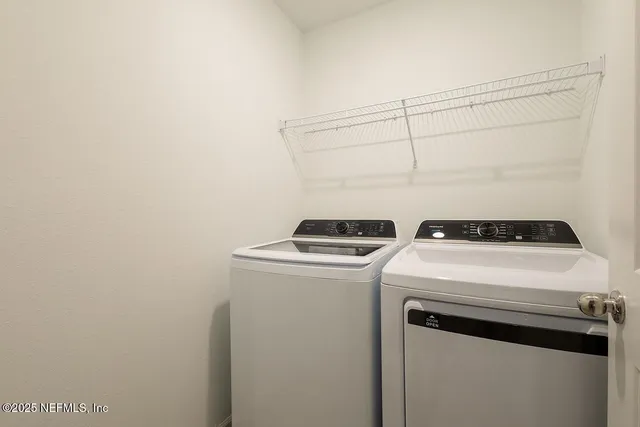 a utility room with dryer and washer