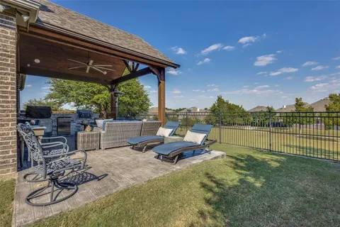a view of swimming pool with outdoor seating