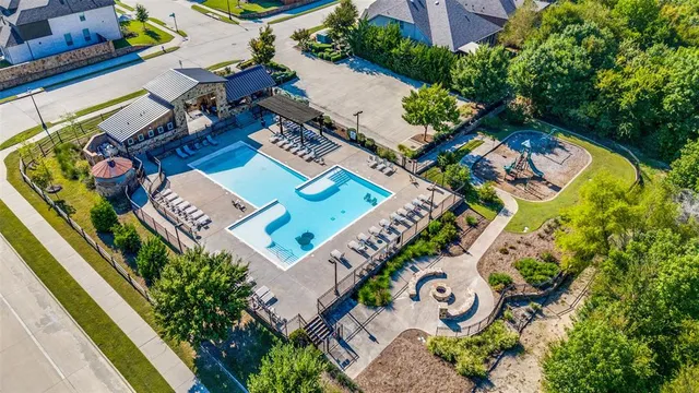 an aerial view of a house a garden and outdoor space