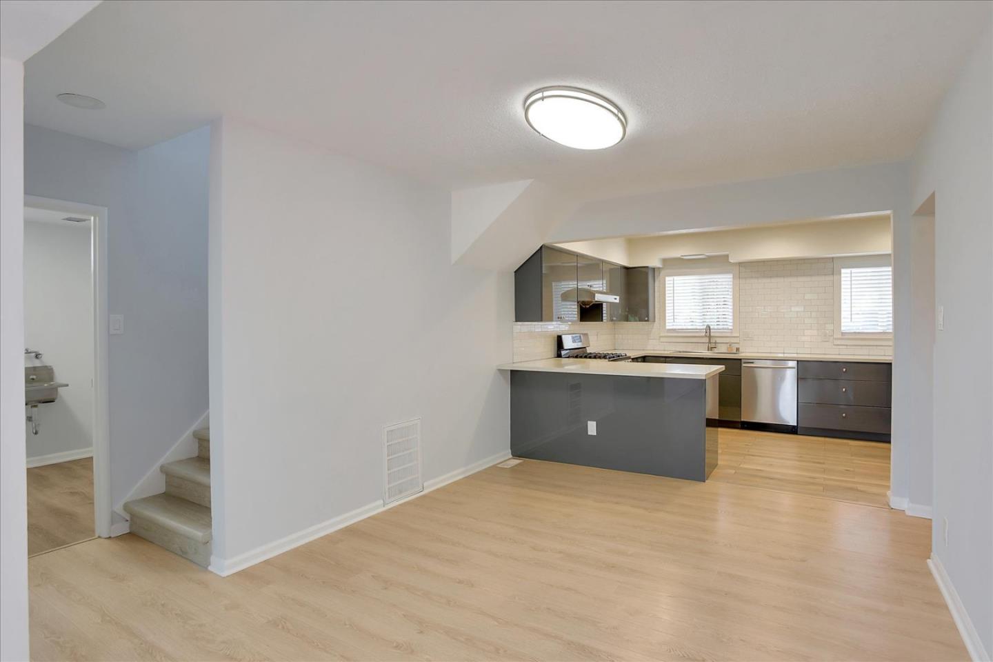 64 Darcy Avenue San Mateo, CA 94403 - Photo 12 of 54 a large kitchen with a sink and cabinets