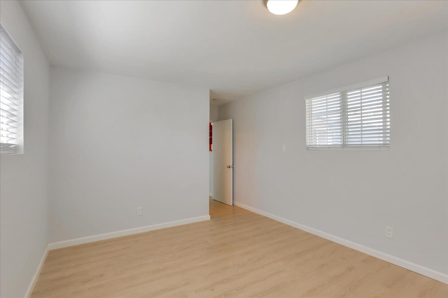 64 Darcy Avenue San Mateo, CA 94403 - Photo 32 of 54 an empty room with windows