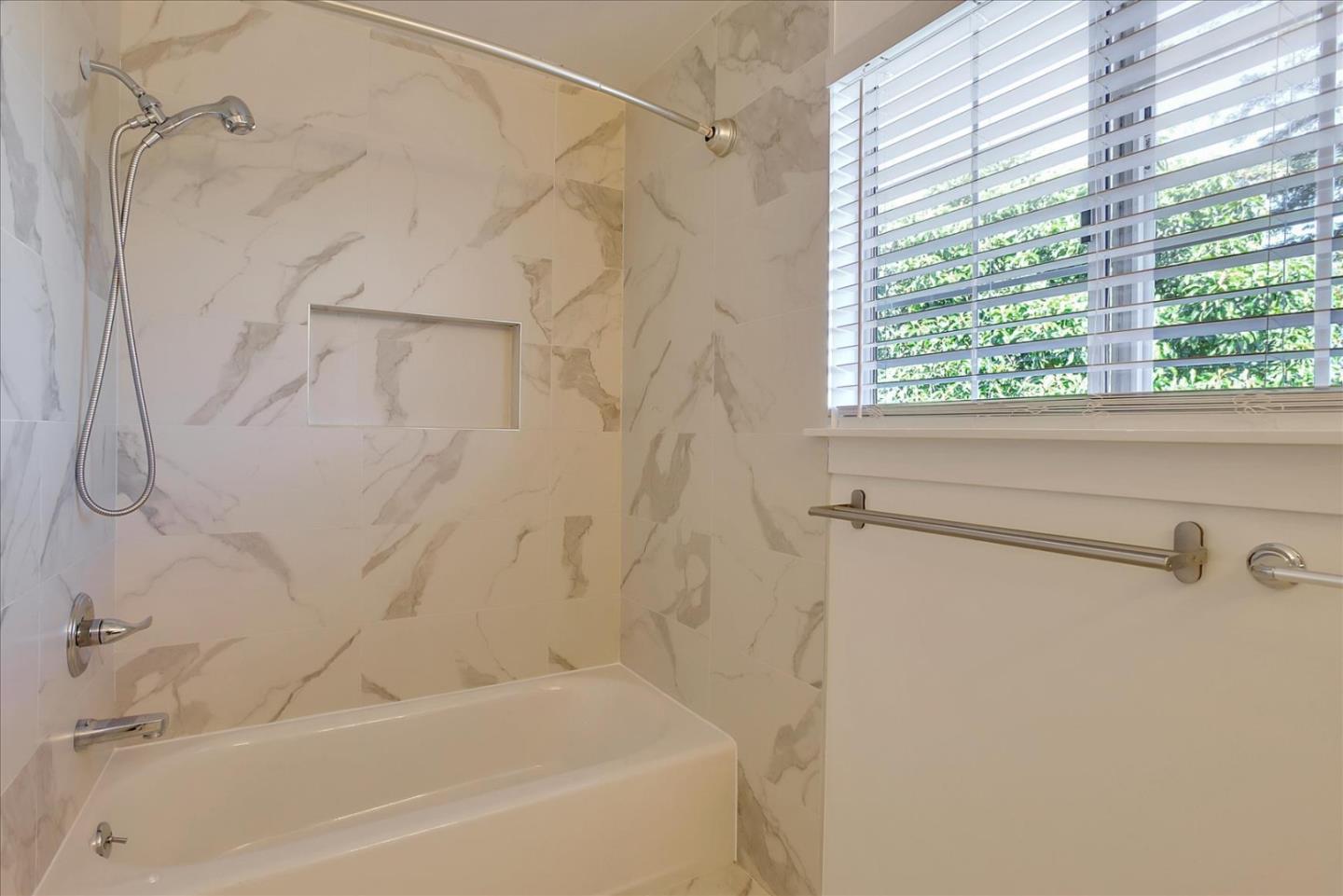 64 Darcy Avenue San Mateo, CA 94403 - Photo 43 of 54 a bathroom with a shower and a bathtub
