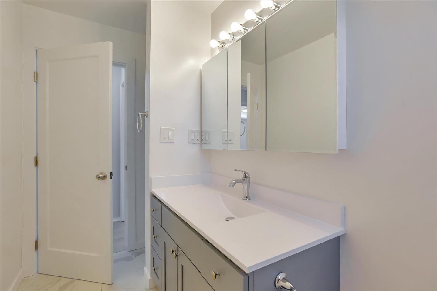 64 Darcy Avenue San Mateo, CA 94403 - Photo 46 of 54 a bathroom with a sink and a mirror