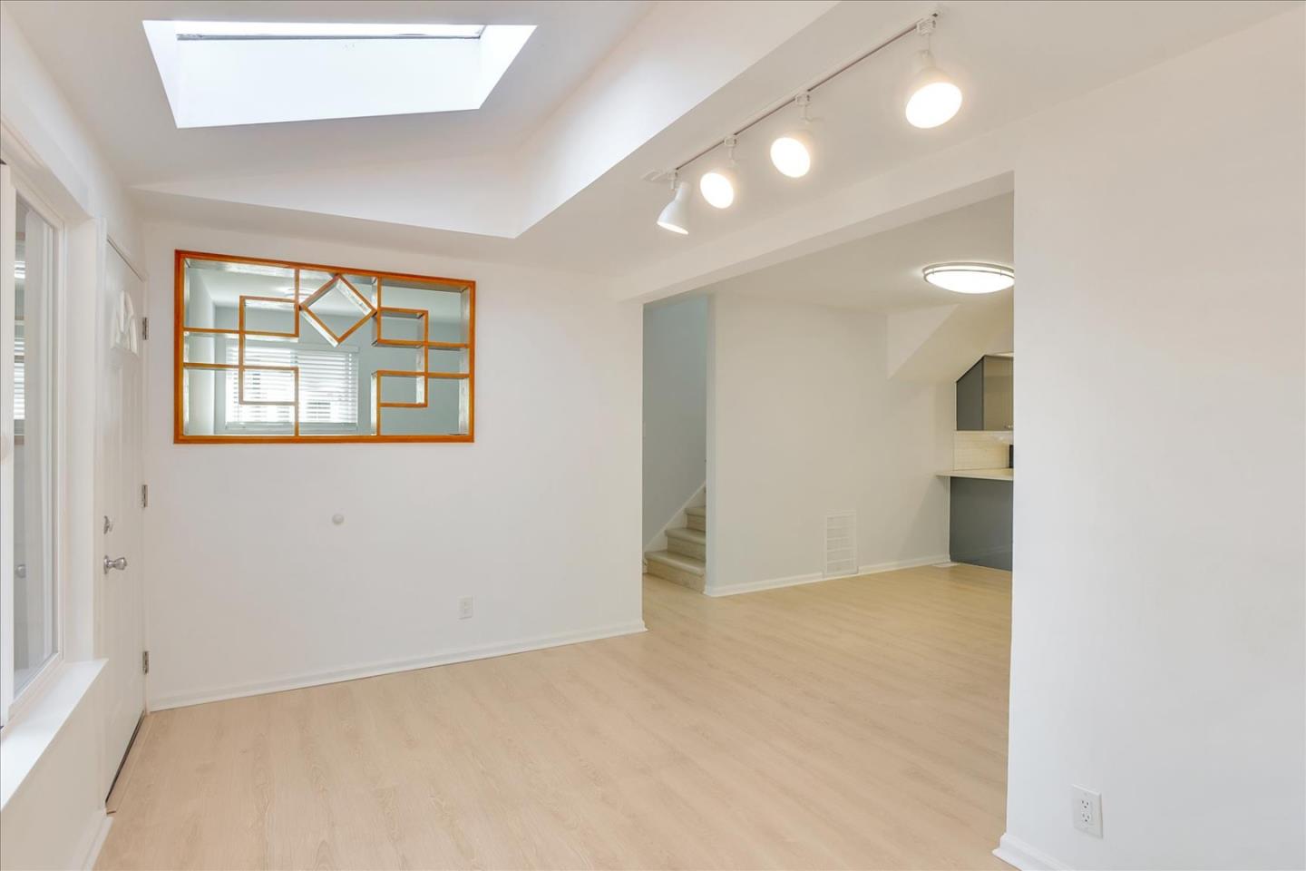 64 Darcy Avenue San Mateo, CA 94403 - Photo 7 of 54 an empty room with windows