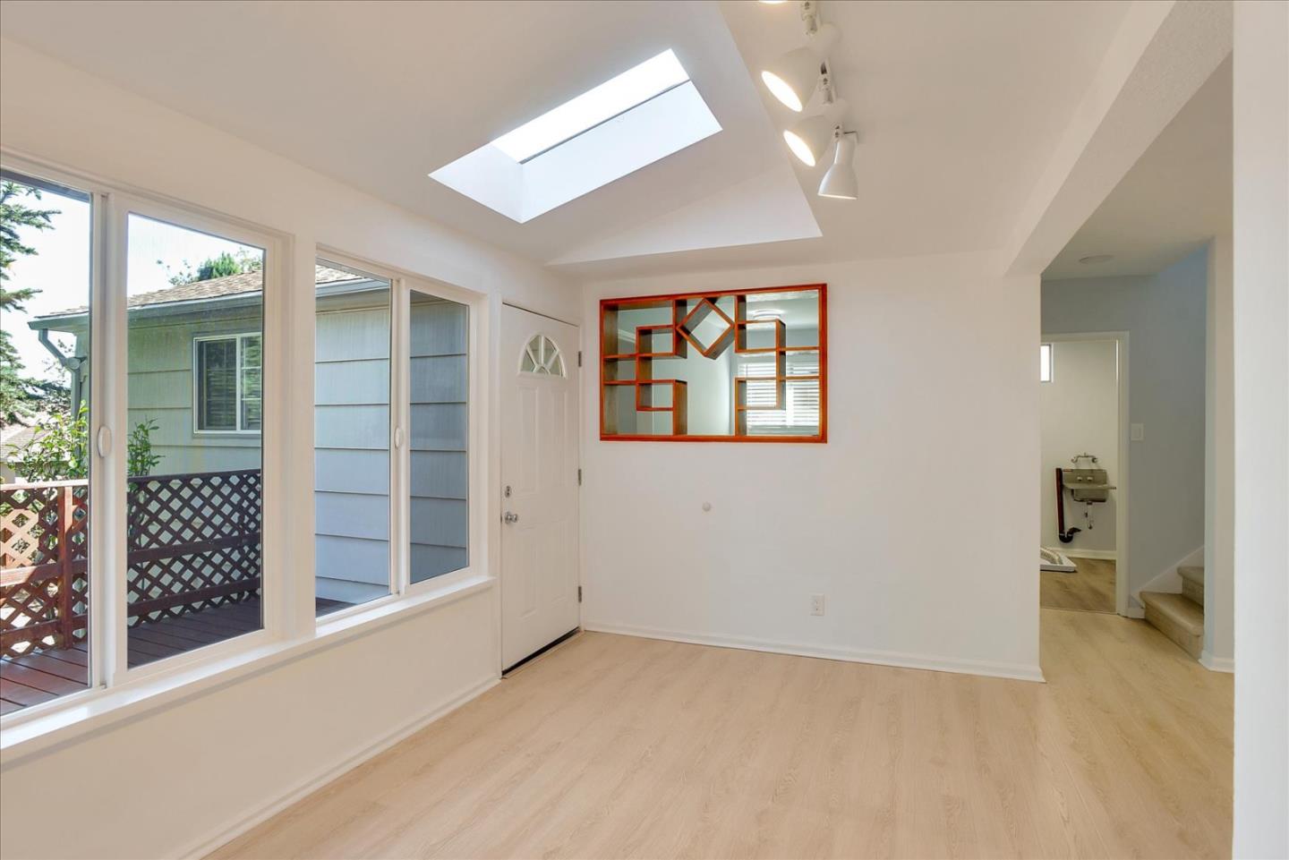 64 Darcy Avenue San Mateo, CA 94403 - Photo 8 of 54 an empty room with windows