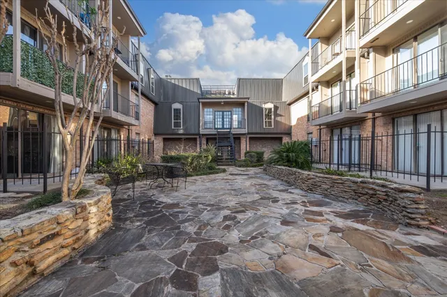 a view of a brick building with many windows