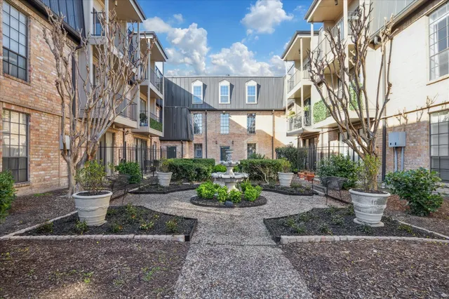 a view of a building with a yard