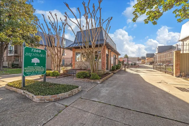a view of a street with a building in the background